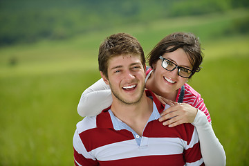 Image showing Portrait of romantic young couple smiling together outdoor