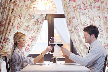 Image showing young couple having dinner at a restaurant