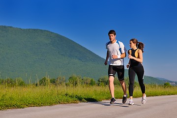 Image showing Young couple jogging