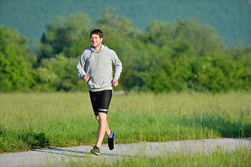 Image showing Young couple jogging