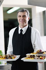 Image showing male chef presenting food