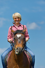 Image showing happy woman  on  horse