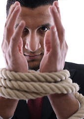 Image showing business man with rope isolated on white background