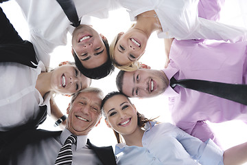 Image showing business people with their heads together