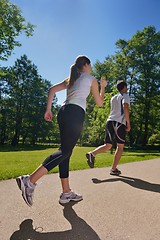 Image showing Young couple jogging at morning