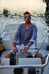 Image showing portrait of happy young man on boat