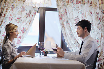 Image showing young couple having dinner at a restaurant