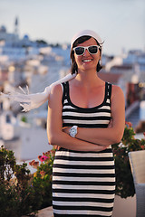 Image showing Greek woman on the streets of Oia, Santorini, Greece