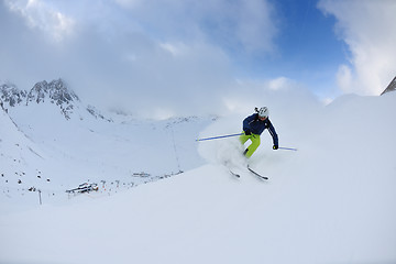 Image showing skiing on fresh snow at winter season at beautiful sunny day