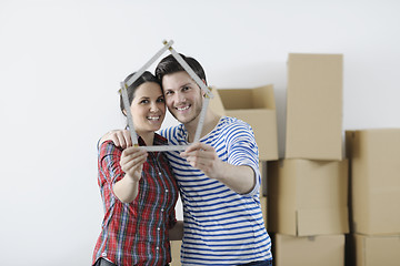 Image showing Young couple moving in new home