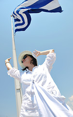 Image showing Greek woman on the streets of Oia, Santorini, Greece