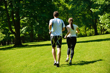 Image showing Young couple jogging at morning