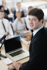 Image showing Young  business man giving a presentation on conference