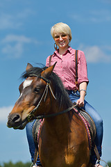 Image showing happy woman  on  horse