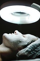 Image showing woman with facial mask in cosmetic studio