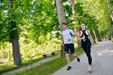 Image showing Young couple jogging