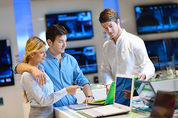 Image showing Young couple in consumer electronics store