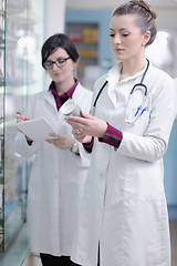 Image showing team of pharmacist chemist woman  in pharmacy drugstore