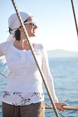 Image showing Greek woman on the streets of Oia, Santorini, Greece