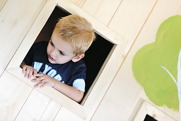 Image showing happy child in a window