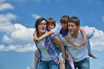 Image showing happy young family have fun outdoors