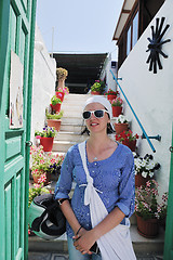 Image showing Greek woman on the streets of Oia, Santorini, Greece