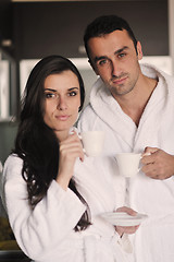 Image showing Young love couple taking fresh morning cup of coffee