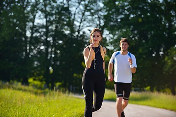 Image showing Young couple jogging