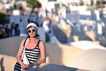 Image showing Greek woman on the streets of Oia, Santorini, Greece