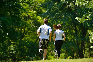 Image showing Young couple jogging