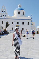 Image showing Greek woman on the streets of Oia, Santorini, Greece