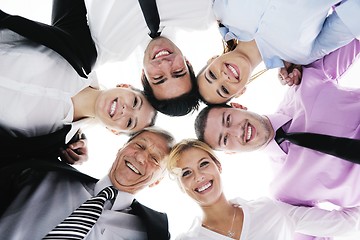 Image showing business people with their heads together