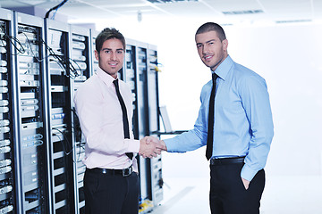 Image showing it enineers in network server room