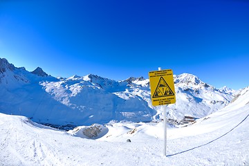 Image showing Sign board at High mountains under snow in the winter