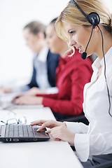 Image showing business woman group with headphones