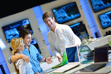 Image showing Young couple in consumer electronics store