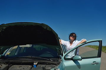 Image showing woman with broken car