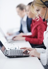 Image showing business woman group with headphones