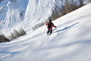 Image showing skiing on fresh snow at winter season at beautiful sunny day