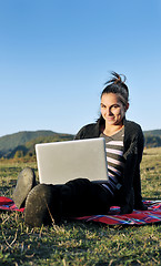 Image showing young teen girl work on laptop outdoor