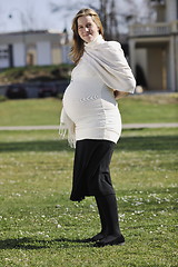 Image showing happy young pregnant woman outdoor