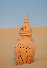 Image showing arabic pot in sand