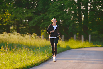 Image showing Young couple jogging