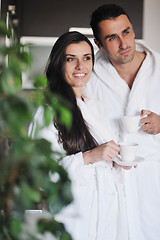 Image showing Young love couple taking fresh morning cup of coffee