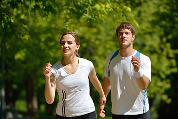 Image showing Young couple jogging