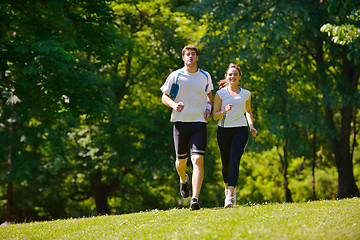 Image showing Young couple jogging