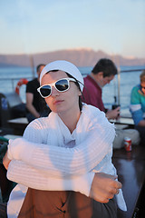 Image showing Greek woman on the streets of Oia, Santorini, Greece