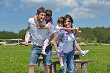 Image showing happy young family have fun outdoors