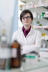 Image showing pharmacist chemist woman standing in pharmacy drugstore