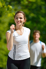 Image showing Young couple jogging